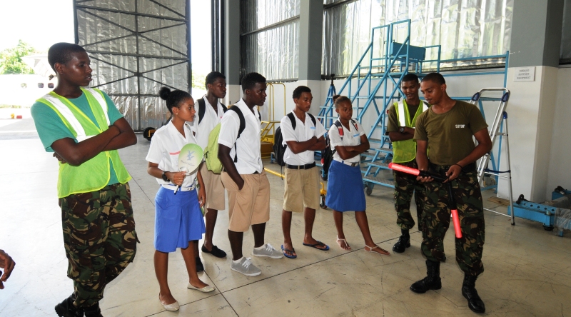 Trained air force technicians explaining the various tools and equipment used by the force